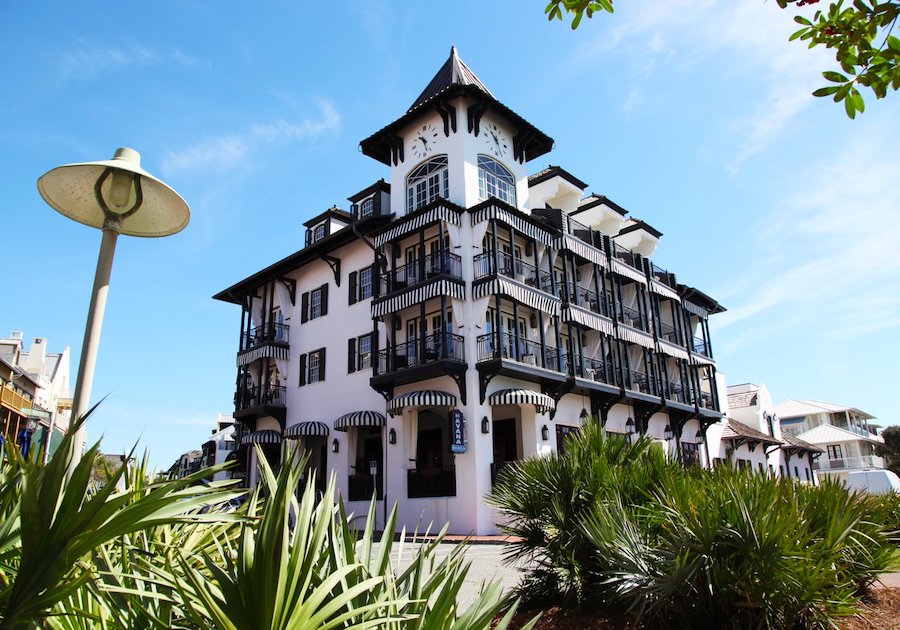 An exterior shot of the Pearl Hotel in Rosemary Beach, a neighborhood in South Walton renowned for its quaint architecture and bleisure attractions.